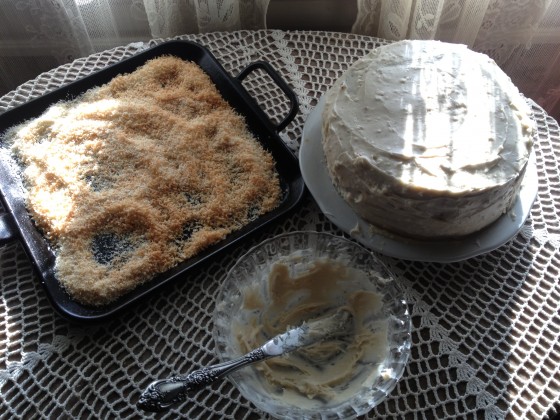 II browned 1 1/2 cups of coconut in the oven on 425 for 10 min's--While cake is still moist add the browned coconut to the top and sides. Just toss it all over, the counter will be a mess!