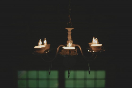 Dale and Rachael made these tea cup light fixtures- Typically mason jar light fixtures hang in barn. Rachael wanted a sophisticated barn wedding so she bought these fixtures for $6 each, painted them white, drilled holes in bottoms of yard sale tea cups and wired them!