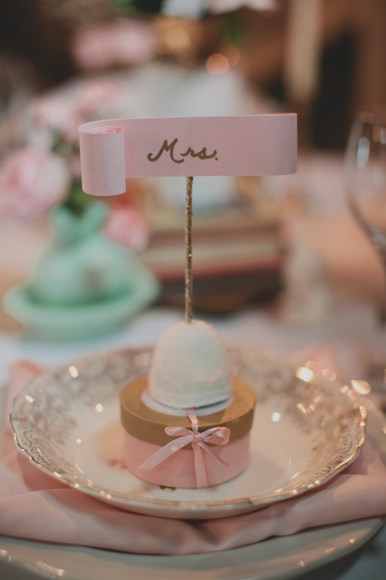 Homemade marshmallows coated in organic coconut held each name written in gold
